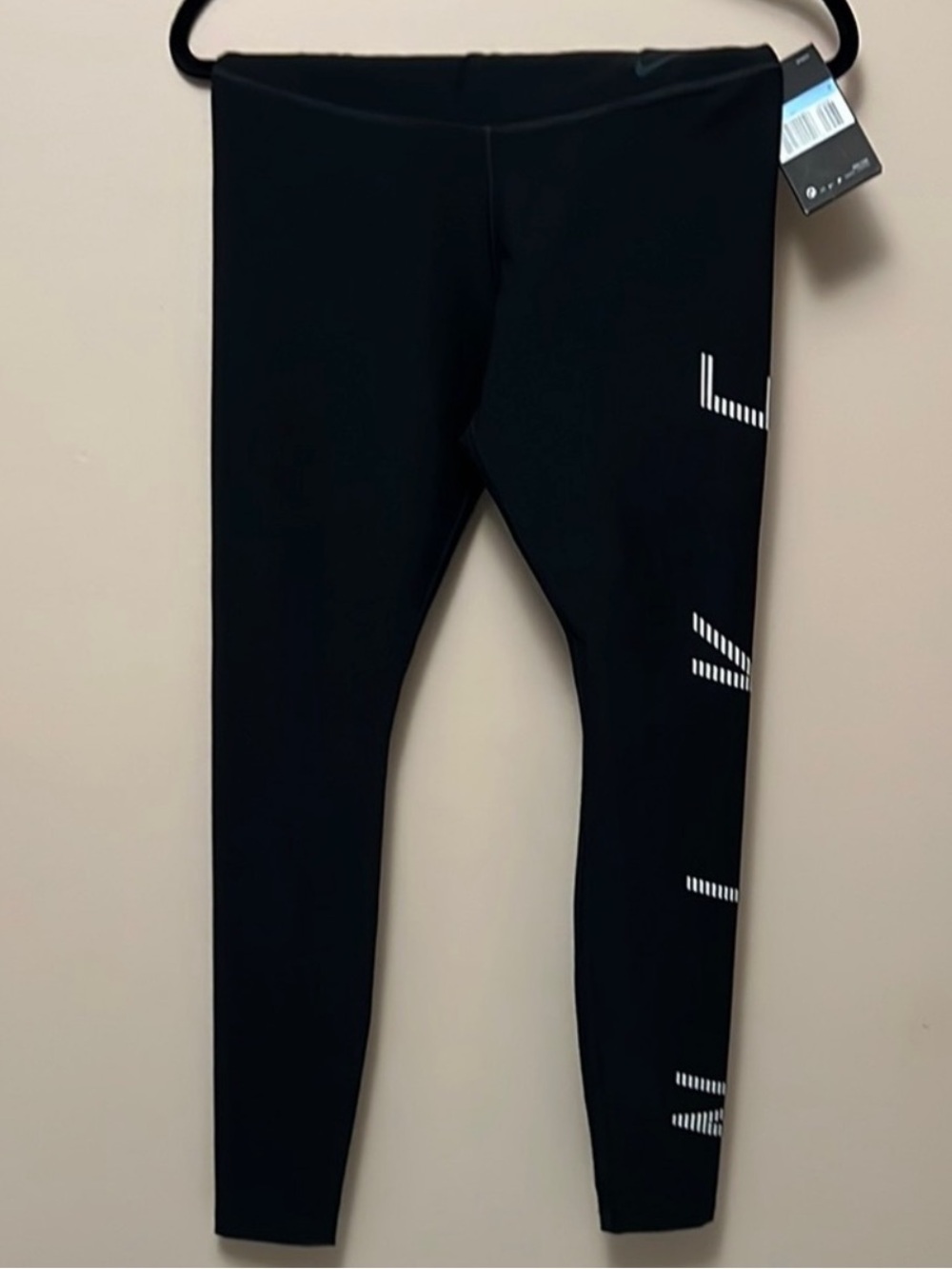Nike Black Tight Fit Leggings with White Tag Accent